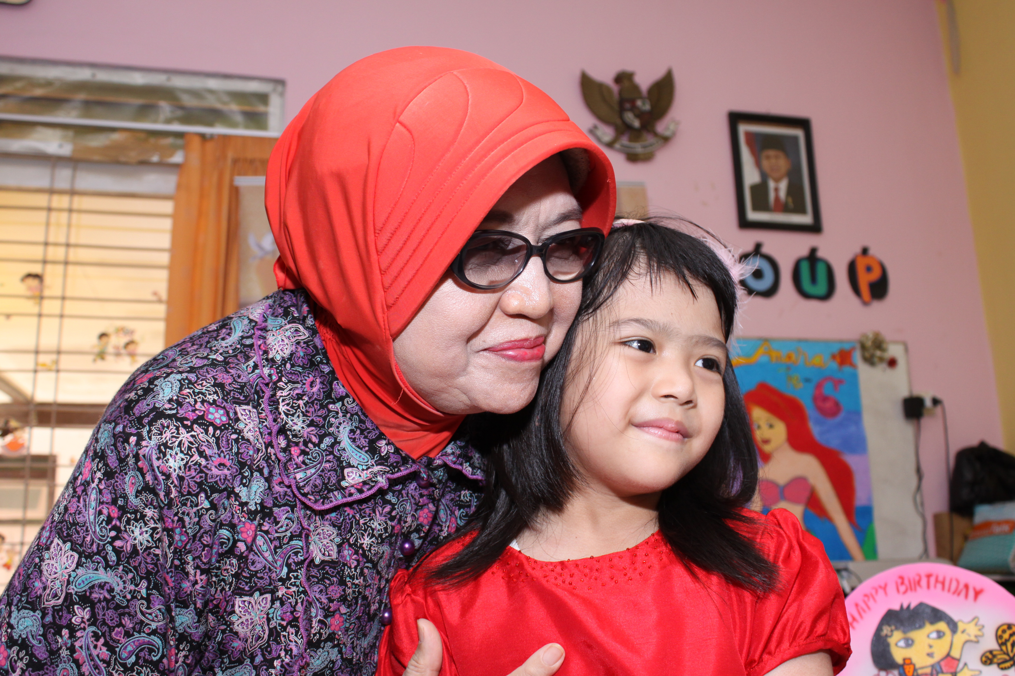 Grandma and child sharing a hug